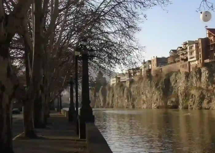 Urban development along the Mtkvari river banks on an Eco tour in Georgia.