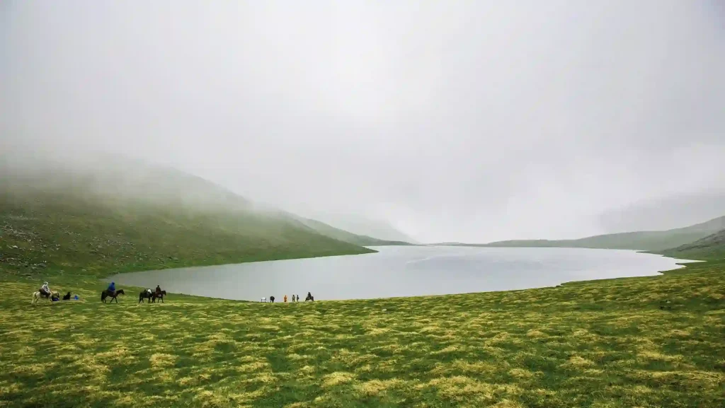Mist covered mountain lake in the Greater Caucasus