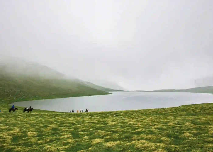 Mist covered mountain lake in the Greater Caucasus