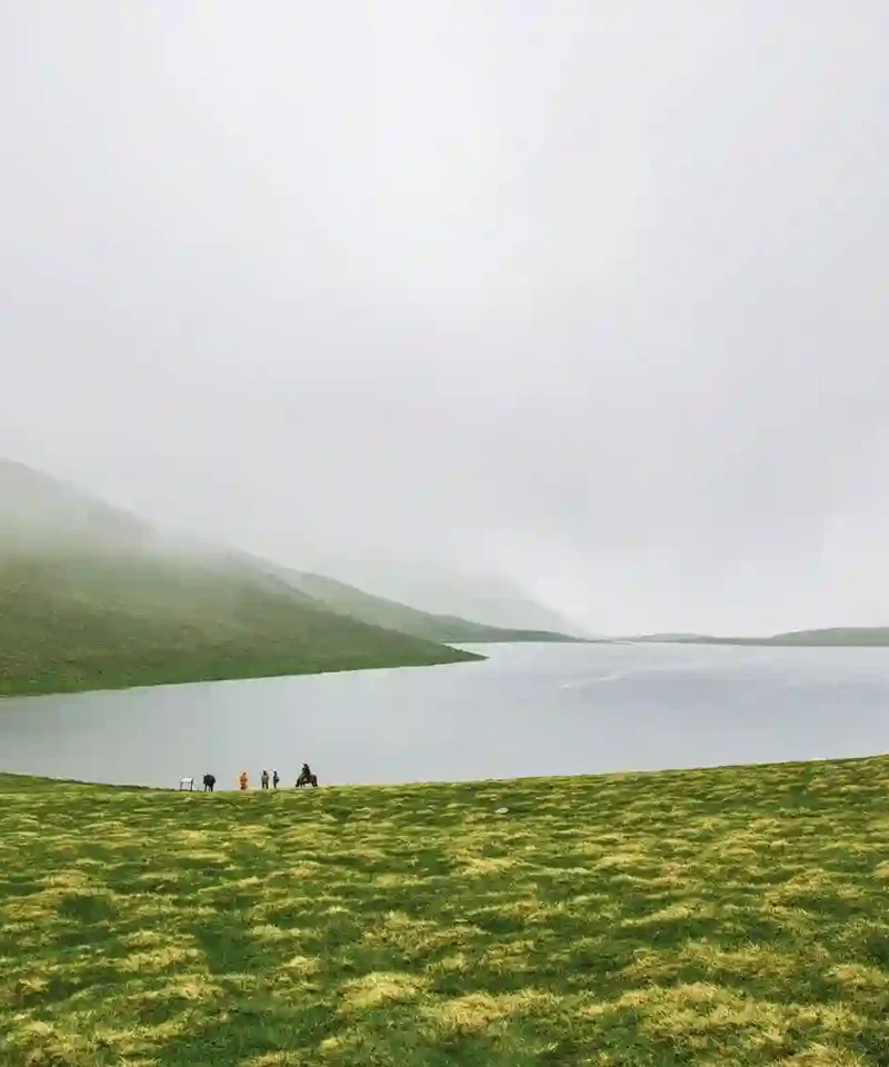 Mist covered mountain lake in the Greater Caucasus