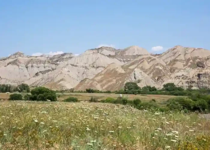 Dramatic geological formations and colorful hills in Vashlovani Reserve.