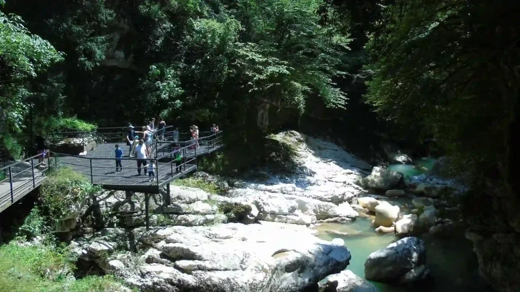 Visitors on the viewing platform overlooking Martvili Canyon and green river
