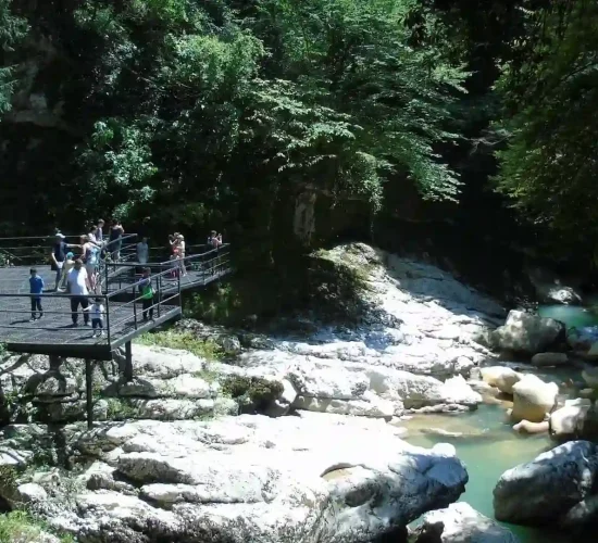 Visitors on the viewing platform overlooking Martvili Canyon and green river