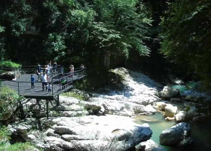 Visitors on the viewing platform overlooking Martvili Canyon and green river