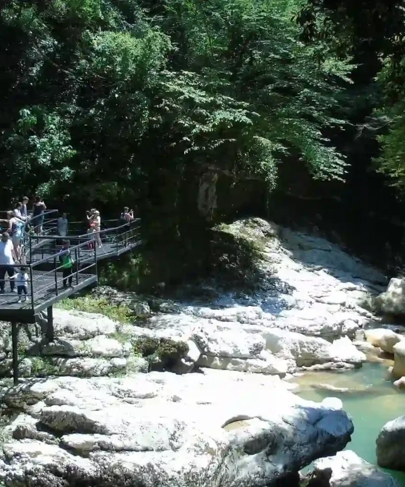 Visitors on the viewing platform overlooking Martvili Canyon and green river