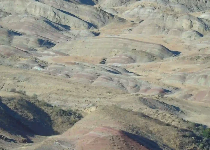 Horizontal colored soil layers and rocks in Gareja desert