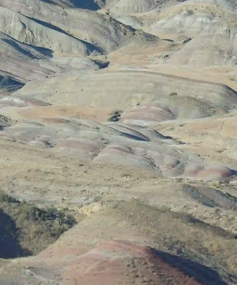 Horizontal colored soil layers and rocks in Gareja desert