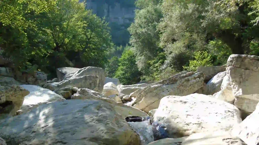 The deep white limestone canyons of Khoni near the waterfall.