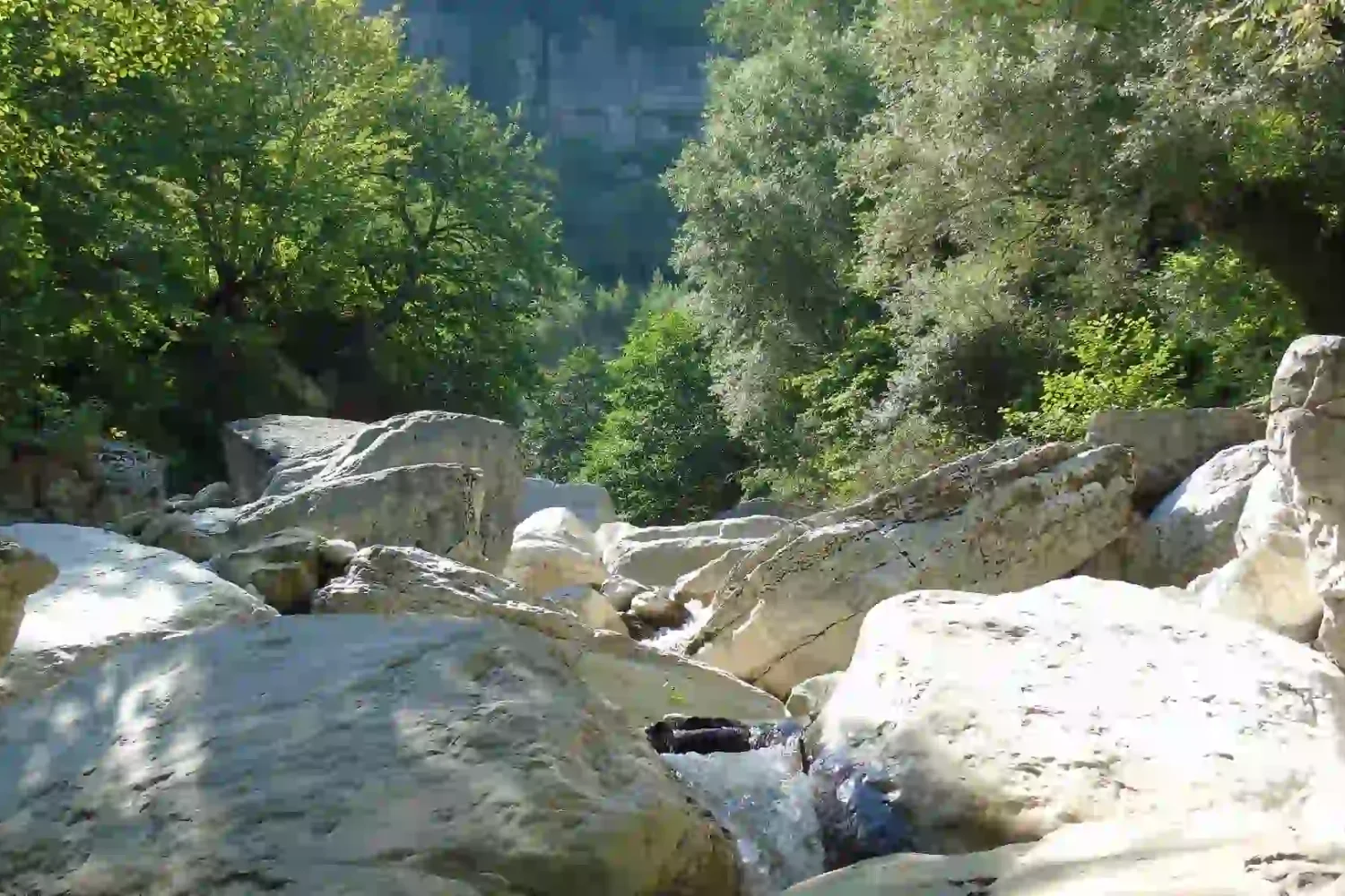 The deep white limestone canyons of Khoni near the waterfall.