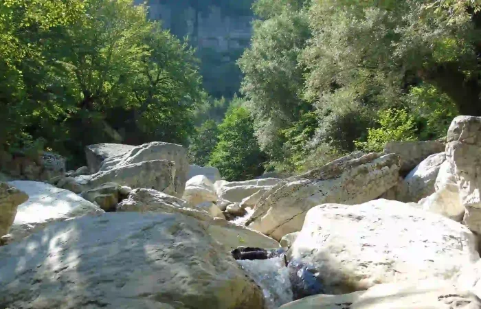 The deep white limestone canyons of Khoni near the waterfall.