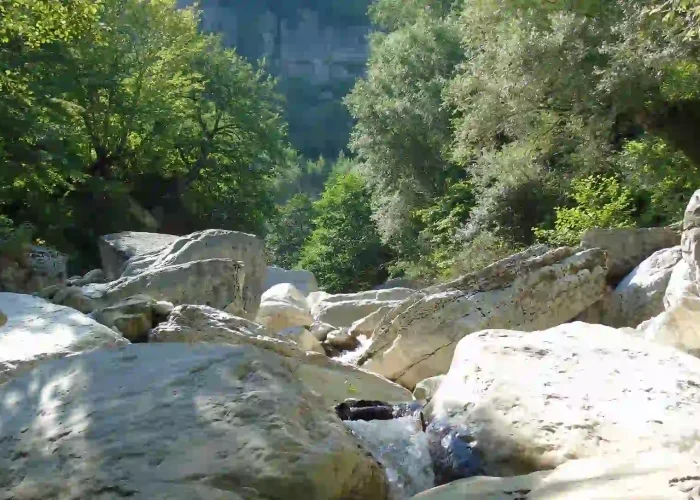 The deep white limestone canyons of Khoni near the waterfall.