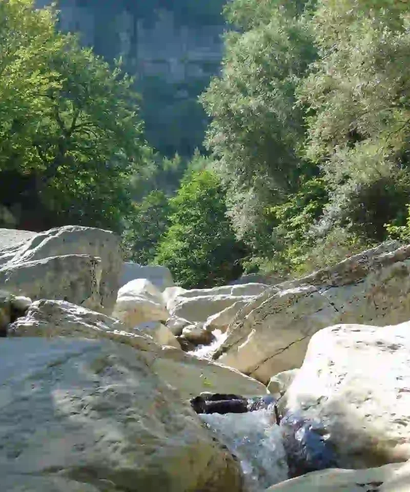 The deep white limestone canyons of Khoni near the waterfall.
