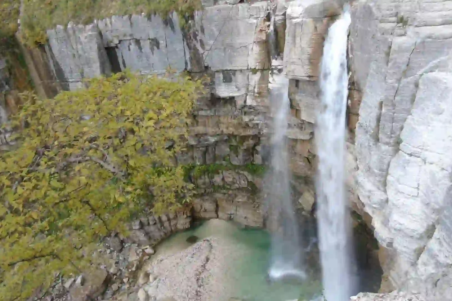 Multiple cascading waterfalls at the Kinchkha natural site.