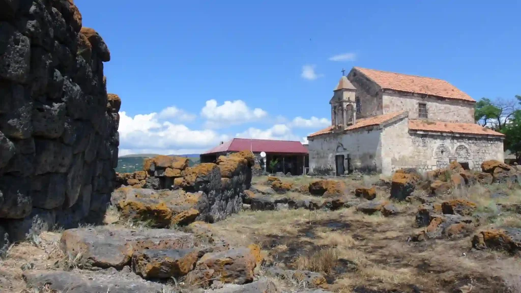 Contrast of prehistoric megaliths and medieval architecture in Saro - Megalithic Tour Georgia