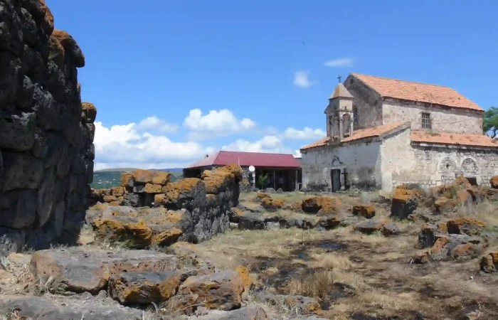 Contrast of prehistoric megaliths and medieval architecture in Saro - Megalithic Tour Georgia