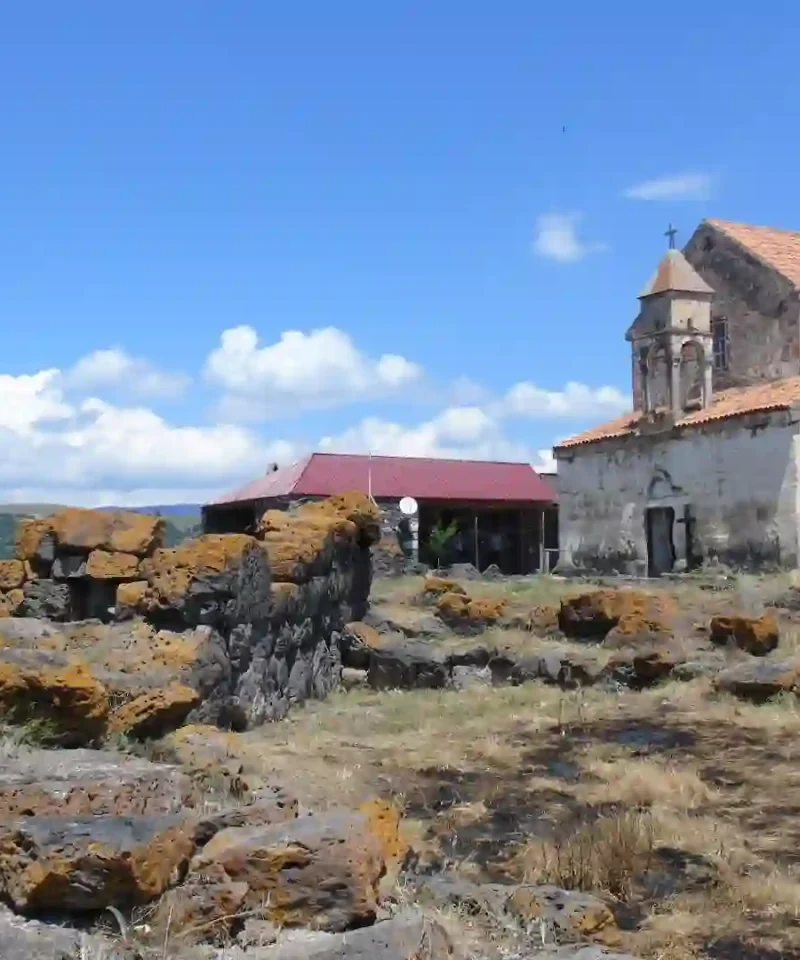 Contrast of prehistoric megaliths and medieval architecture in Saro - Megalithic Tour Georgia