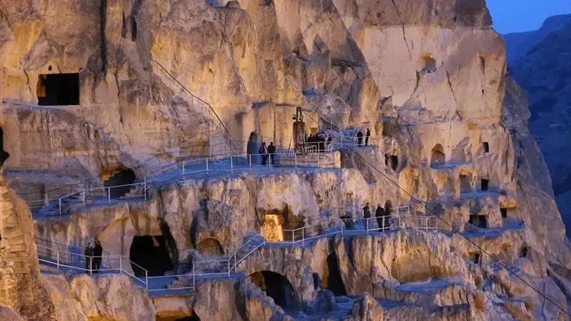 Illuminated night view of the 12th-century Vardzia cave complex
