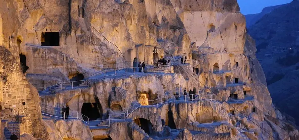 Illuminated night view of the 12th-century Vardzia cave complex