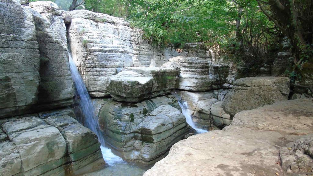 Okatse Waterfall, small river in the rock