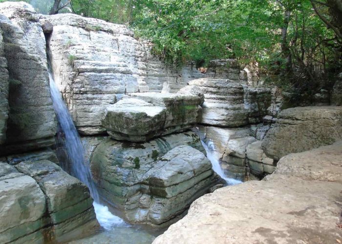 Okatse Waterfall, small river in the rock