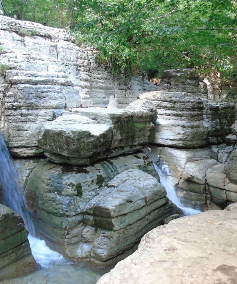 Okatse Waterfall, small river in the rock