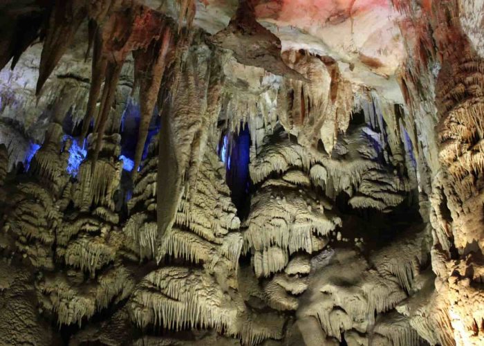 The interior of the Sataplia cave with colorful lights