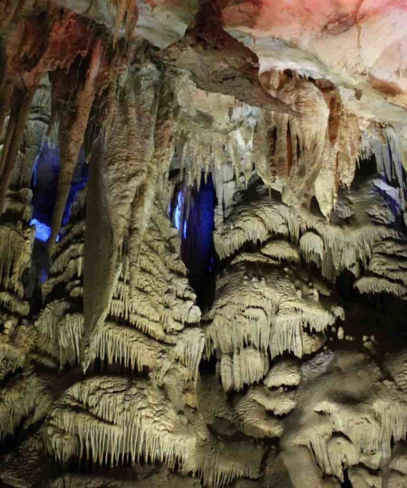 The interior of the Sataplia cave with colorful lights