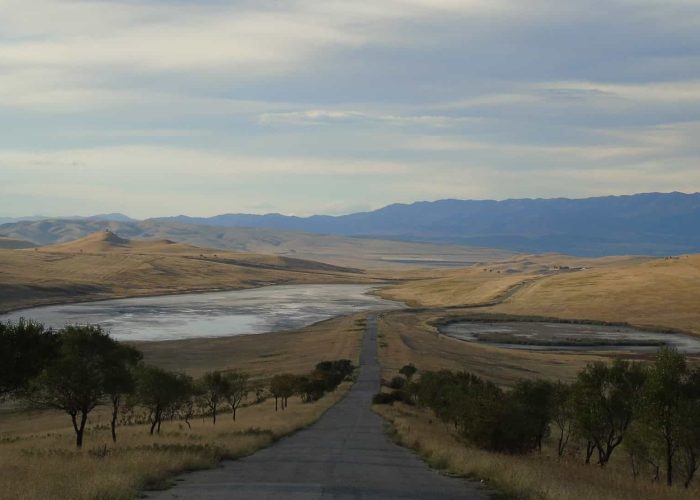 In the foreground, the road from David Gareja to Tbilisi, salt lakes on the left and right