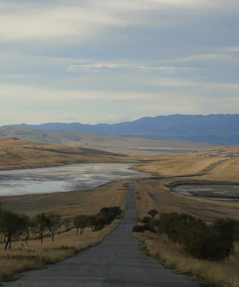 In the foreground, the road from David Gareja to Tbilisi, salt lakes on the left and right