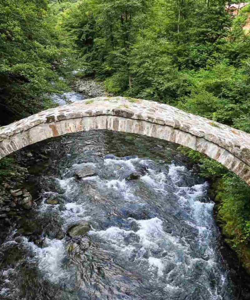 A medieval stone King Tamar bridge over a small river