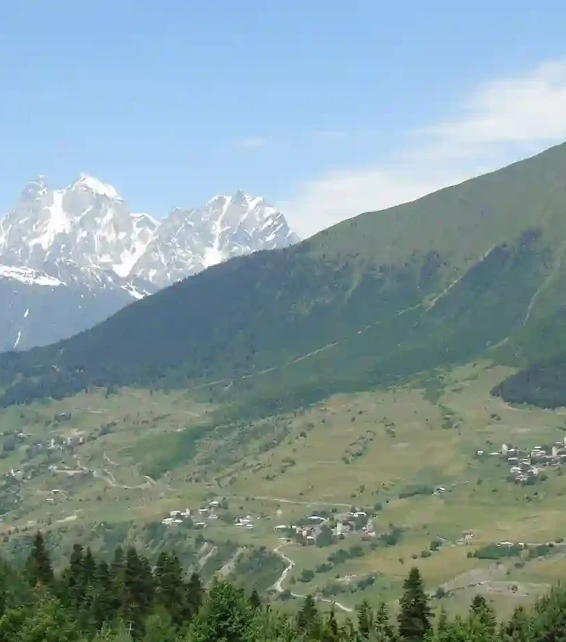 The iconic double-peaked Mount Ushba towering over the alpine villages of Svaneti.