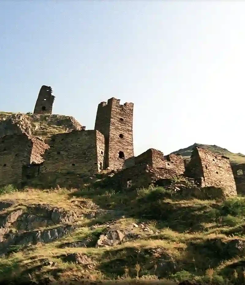 The medieval stone towers of Mutso fortress built on a steep rocky cliff in Khevsureti, Georgia.